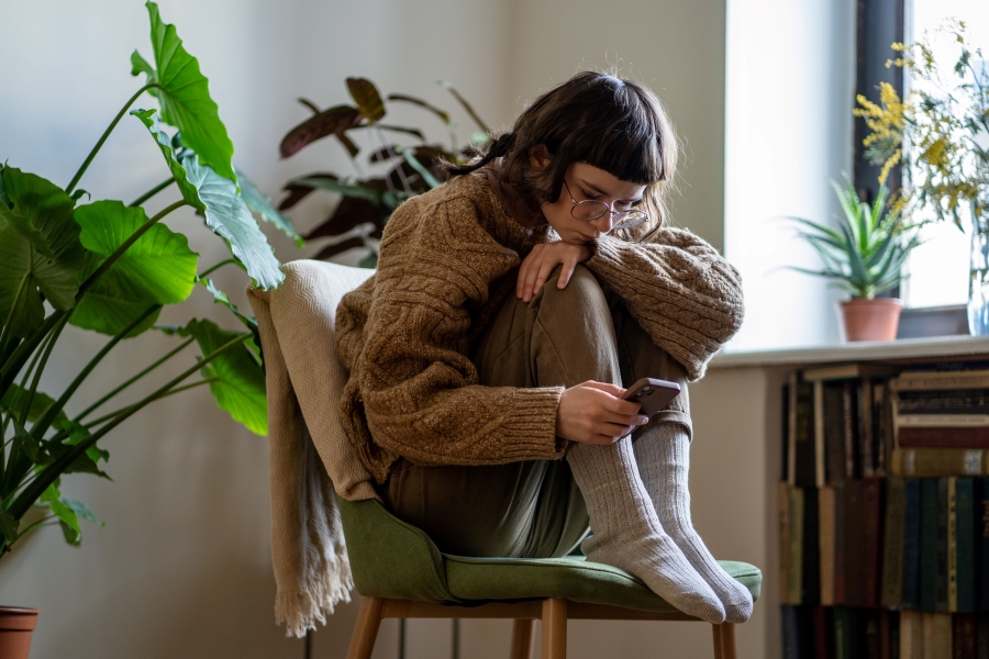 girl on a chair with mobile phone